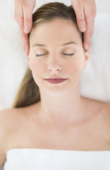 Obraz na płótnie Canvas Beautiful Woman Receiving Head Massage At Health Spa