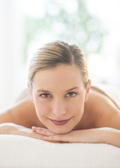 Portrait Of Beautiful Woman Relaxing At Spa