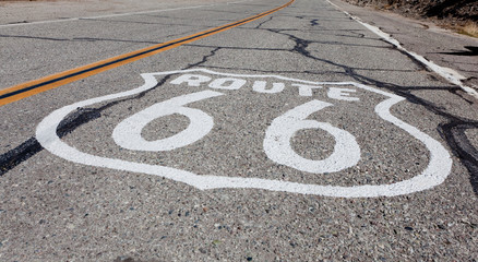 Route 66 highway shield painted on a old highway in California