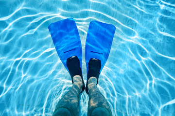Male legs in flippers underwater © Pavel Losevsky