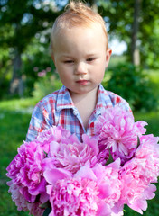 cute little boy with peonies