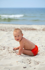 cute boy having fun on beach