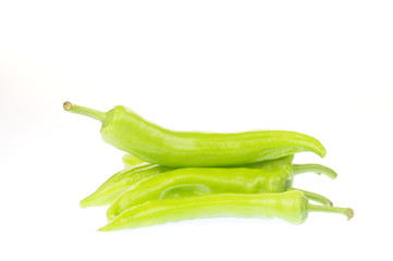 The green peppers on a white background