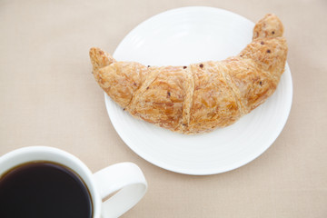 Croissant and a cup of coffee
