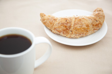 Croissant and a cup of coffee