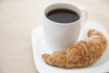 Croissant and a cup of coffee