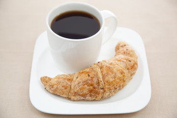 Croissant and a cup of coffee