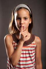 little girl showing silence gesture © xavier gallego morel
