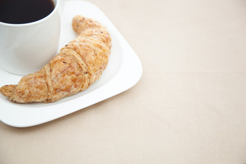 Croissant and a cup of coffee