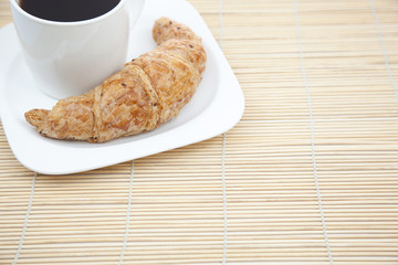 Croissant and a cup of coffee