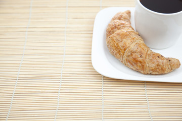 Croissant and a cup of coffee