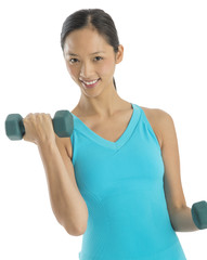 Portrait Of Beautiful Woman Lifting Dumbbells