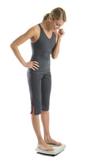 Fototapeta premium Happy Woman Weighing Herself On Weight Scale