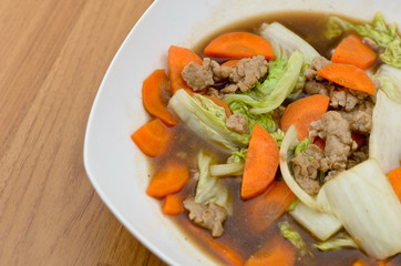 Fried lettuce with mince pork and carrot in oyster sauce