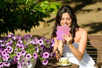 Woman reading ebook in garden