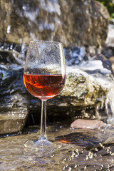 delicious fresh rosé wine chilled in waterfall