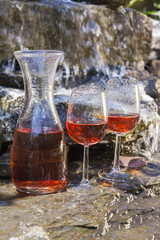 delicious fresh rosé wine chilled in waterfall