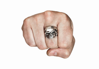 Fist with a ring in the form of a skull on a white background