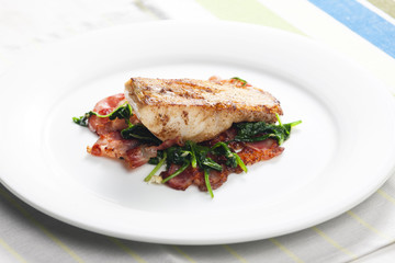 tilapia fillet with warm spinach and bacon salad