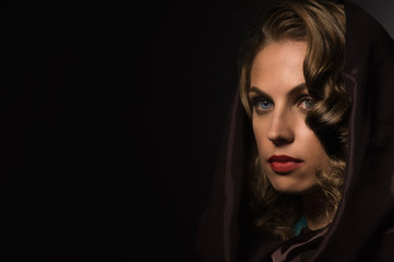 Fototapeta premium Beautiful woman in a hood