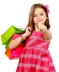 little girl with shopping bags pointing you