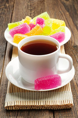Cup of tea and colorful marmalade