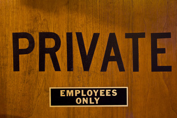 A PRIVATE - EMPLOYEES ONLY Sign Prominently Displayed on a Door