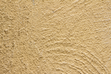 Yellow rough cement wall background