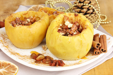 Baked apples on plate close up