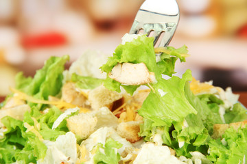 Caesar salad, close up, on bright background