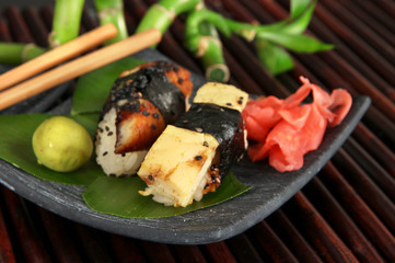 Tasty Maki sushi - Roll on plate on bamboo mat