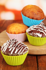 Sweet cupcakes on wooden table