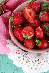 Strawberry on napkin in basket close-up