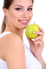 Smiling woman with apple isolated on white