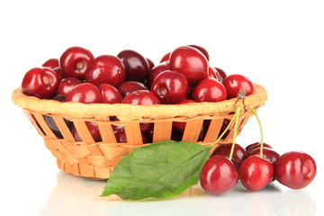 Cherry berries in wicker basket isolated on white