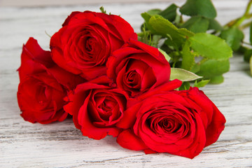 Beautiful bouquet of roses on table close-up
