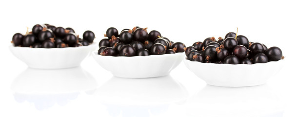 Fresh black currant isolated on white