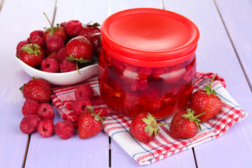 Home made berry jam on wooden table