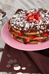 Chocolate cake on wooden table close-up