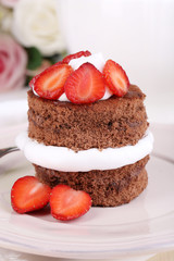 Chocolate cake with strawberry on table close-up