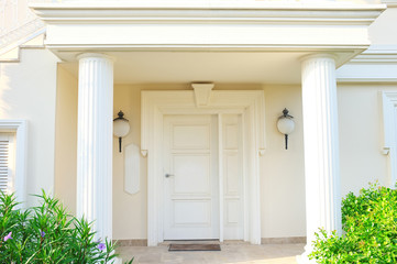 White front door of house with columns