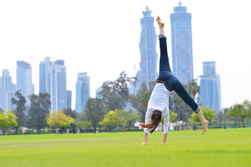 young woman jumping in park