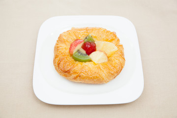 Coffee cup and croissant