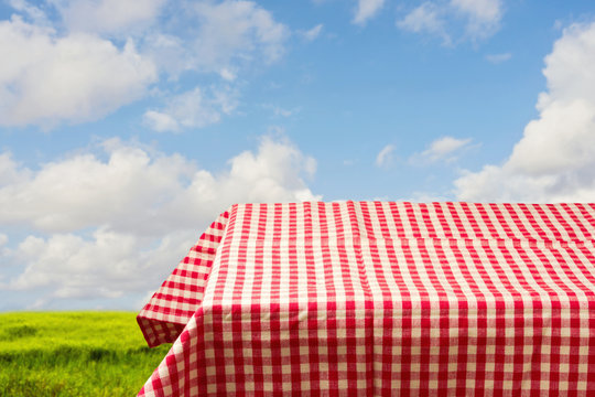 Empty Table Covered With Red Checked Tablecloth