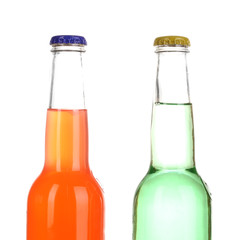 Tasty drinks in bottles isolated on white