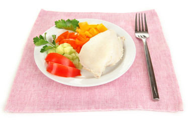 Boiled chicken breast on plate with vegetables close up