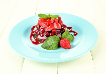 Tasty jelly dessert with fresh berries,