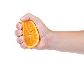 Hand squeeze ripe juicy orange. White background.