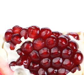 Pomegranate slice isolated on white, close up.