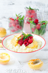 Milk porridge with raspberries and apricots